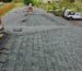 Old shingles being removed during roof installation in Sherwood OR