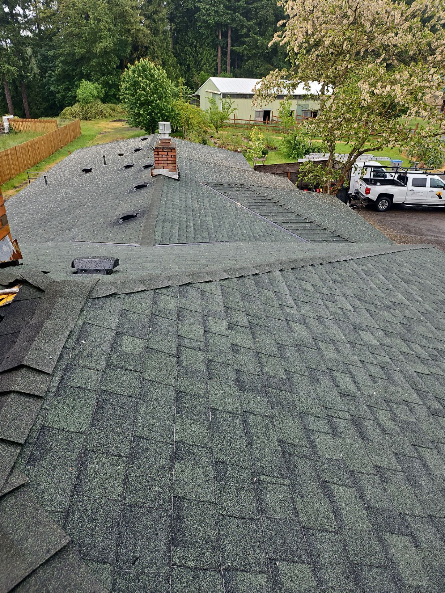 Old shingles being removed during roof installation in Sherwood OR
